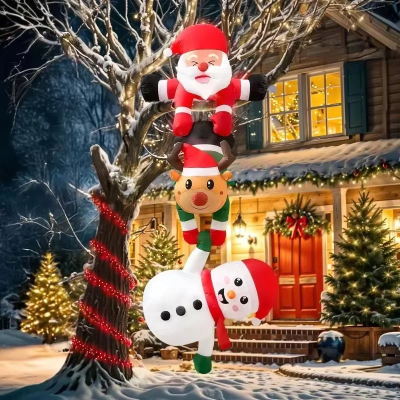 An inflatable decoration featuring Santa, a reindeer, and a snowman stacked on a tree in a snowy outdoor setting.