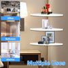 A set of three white wall-mounted corner shelves displaying various household items in an interior setting.