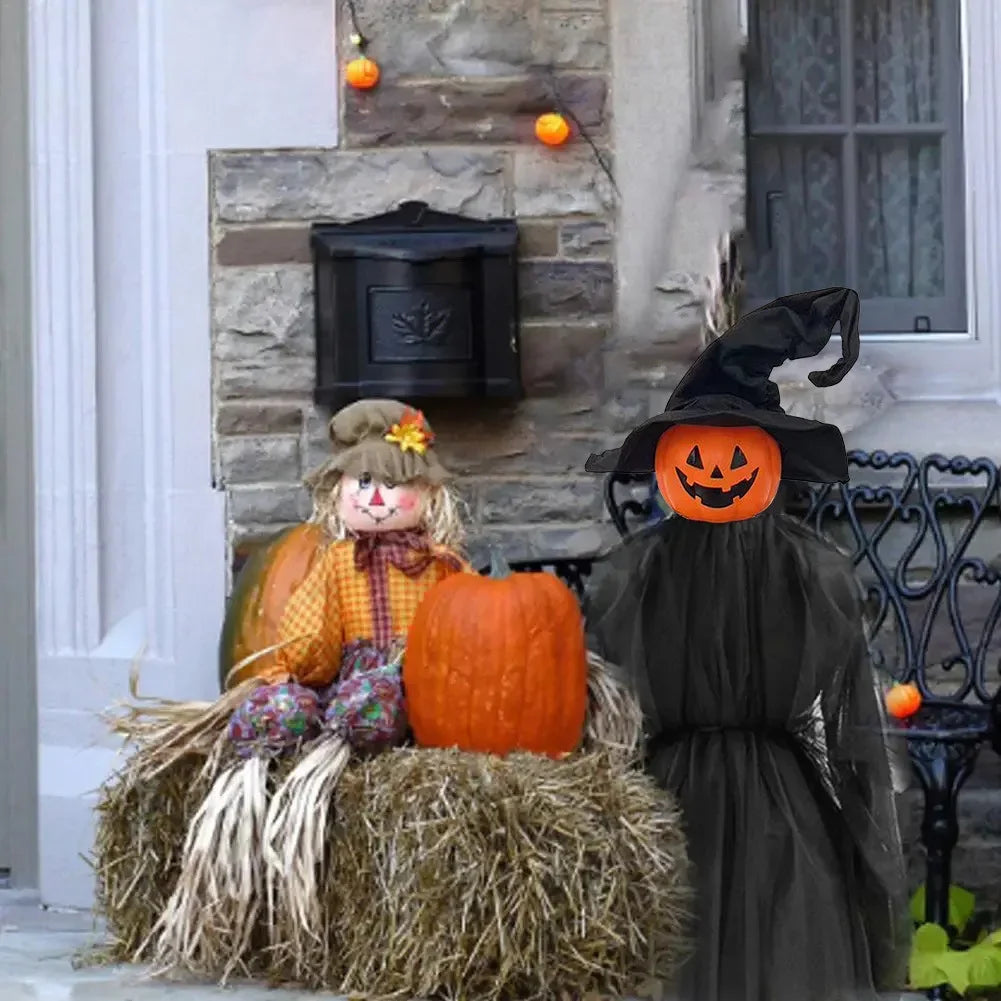 A witch decoration set featuring a black pointed hat and a pumpkin face displayed on a stone wall.