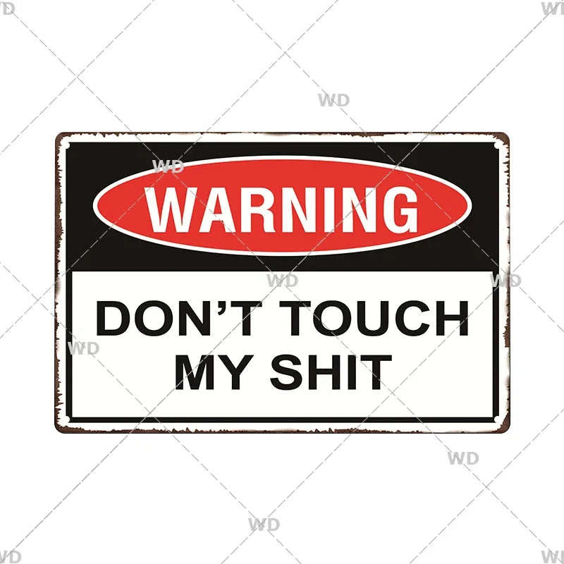 A vintage metal warning sign with a red oval banner that reads WARNING and below it says DON'T TOUCH MY SHIT.