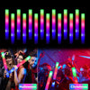 A display of vertical LED foam glow sticks in various colors, including pink, green, and blue, used for Halloween and Christm
