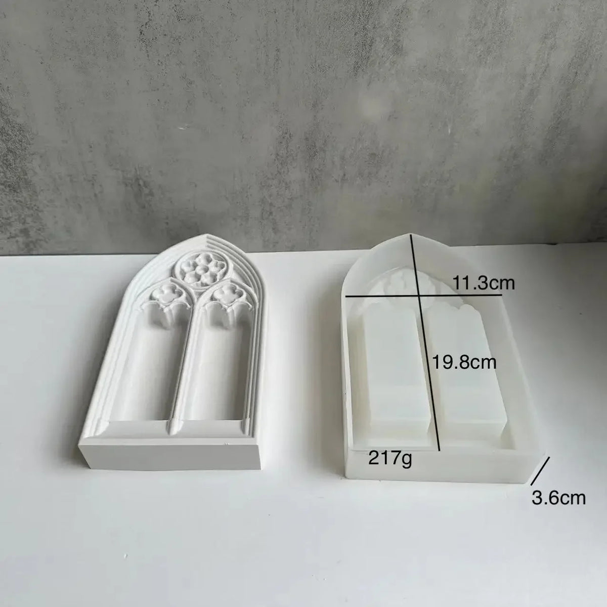 White silicone mold shaped like a church window for crafting resin or plaster