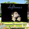 A black banner featuring a close-up portrait of a man smoking, intended as Deftones band flag wall decor.