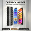 A black wall-mounted cap rack organizer holding multiple baseball hats in various colors.