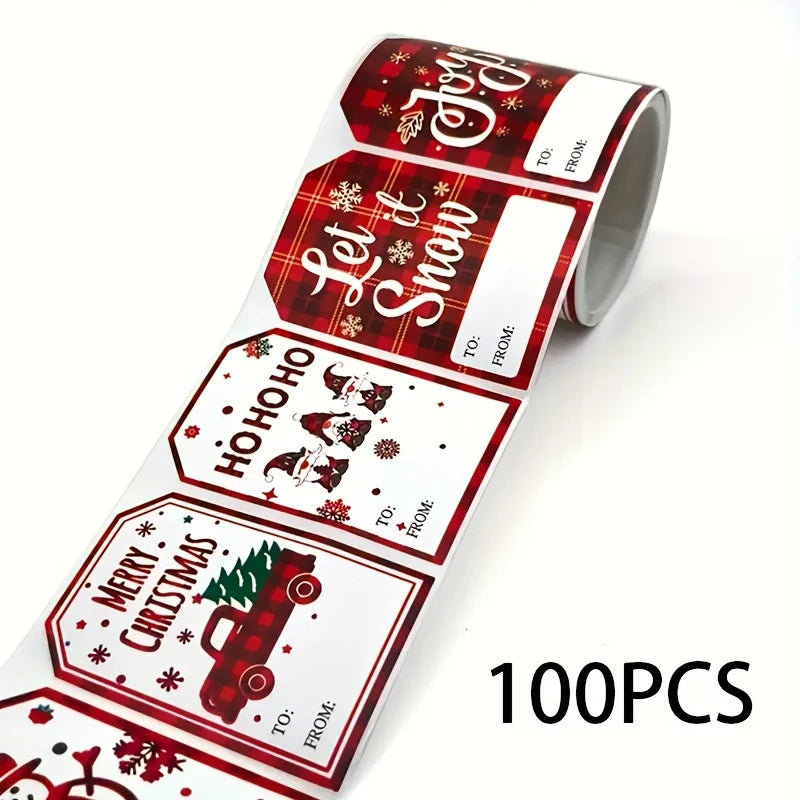 A roll of Christmas present stickers featuring holiday phrases like Let It Snow and Merry Christmas