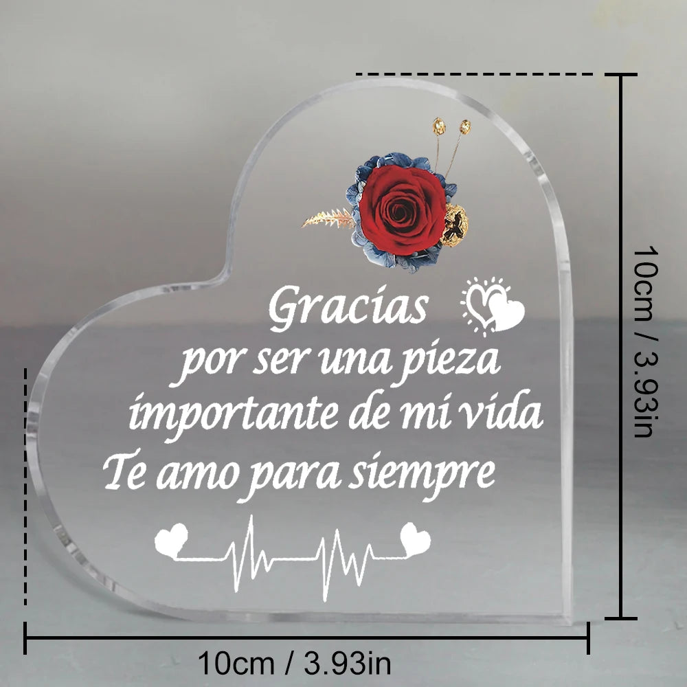 Clear heart-shaped glass keepsake frame with a red rose and text that reads Gracias por ser una pieza importante de mi vida T