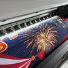 A colorful birthday party decoration set featuring a patriotic design with fireworks and stripes.