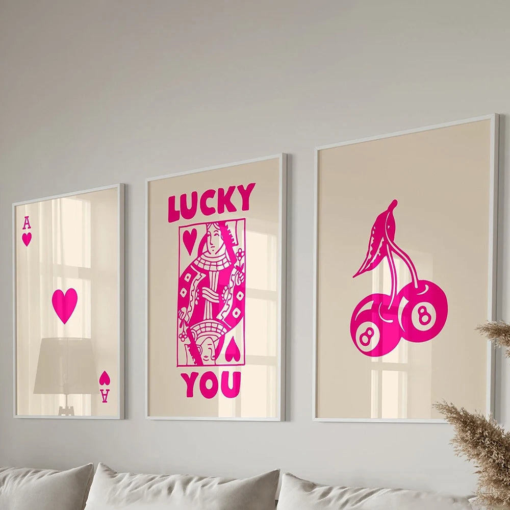 Three framed art prints featuring pink and purple retro letter designs on white backgrounds