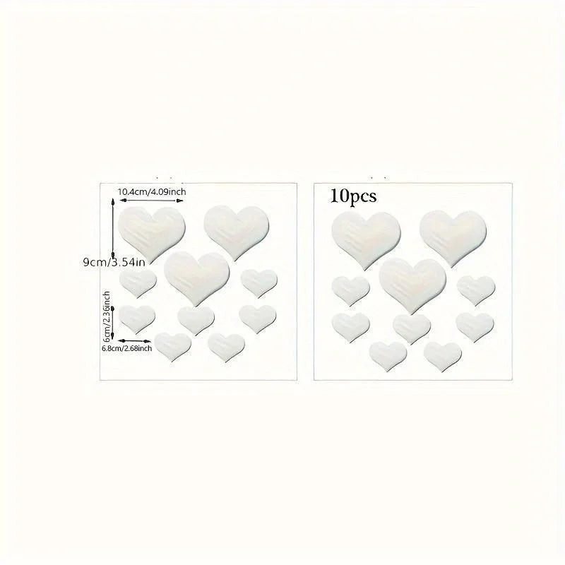 A set of ten heart-shaped mirror wall stickers measuring 10.4cm in diameter.