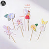 A set of twelve fairy cupcake toppers featuring various winged figures and flowers on wooden sticks.