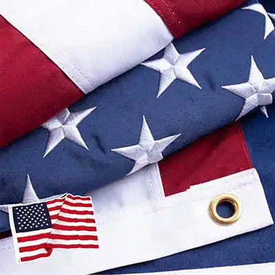 Embroidered American flag fabric with red and blue stripes and white stars, featuring brass grommets.