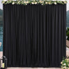 Elegant rectangular black drape backdrop with white floral garland for events