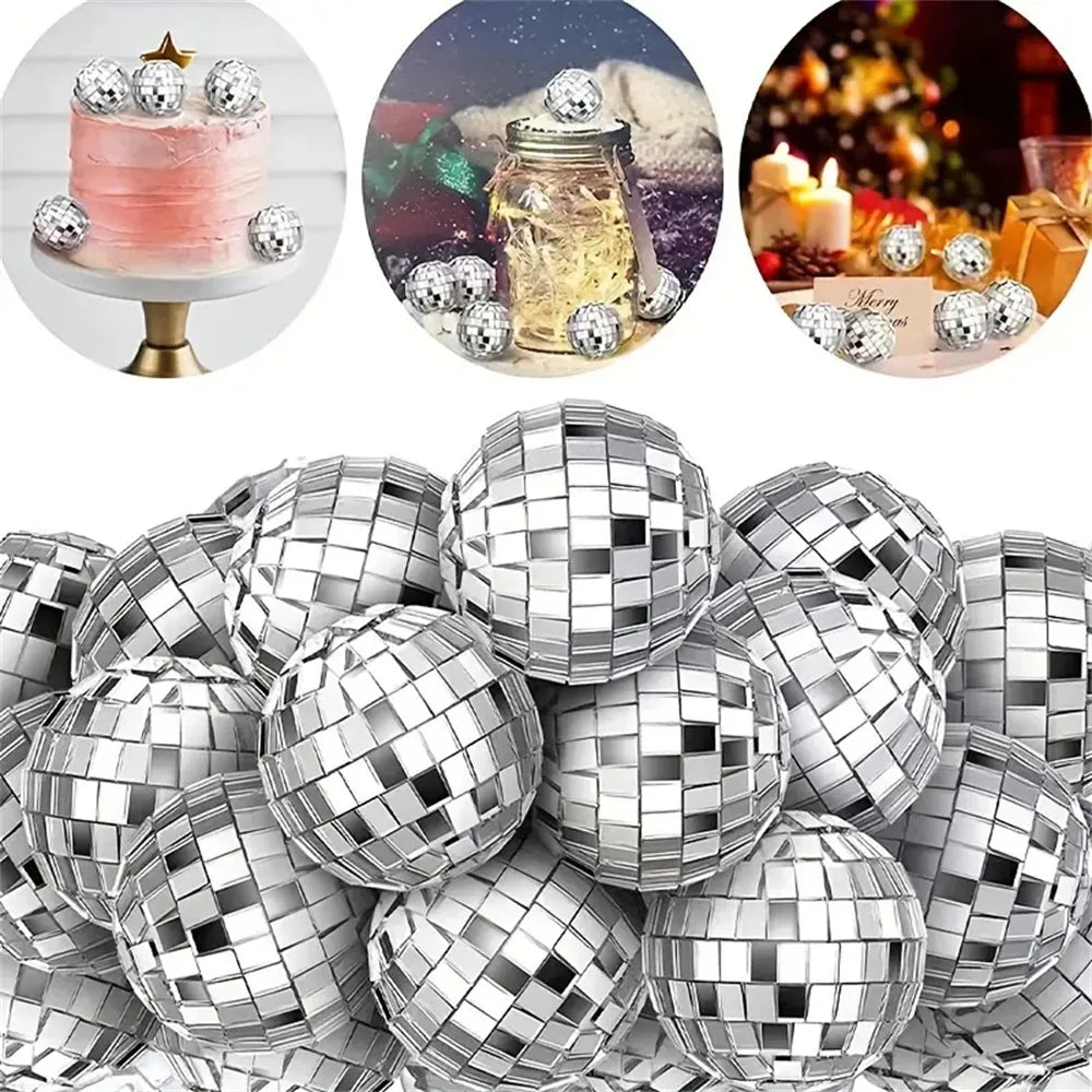 A collection of silver disco ball ornaments and a pink cake with gold accents.