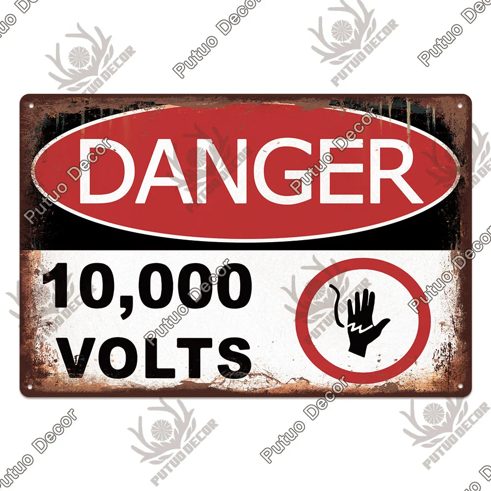 A vintage metal warning sign with red and white text indicating danger and 10,000 volts.