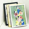 Three picture frames displaying a colorful floral painting in various wood and acrylic frames.