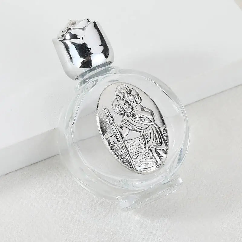 Decorative glass bottle with a silver figurine and twist cap