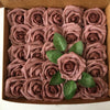 A box filled with artificial real touch foam roses in various shades of dusty rose and mauve.