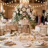 Gold geometric flower stands with white and pink roses and greenery for table decor