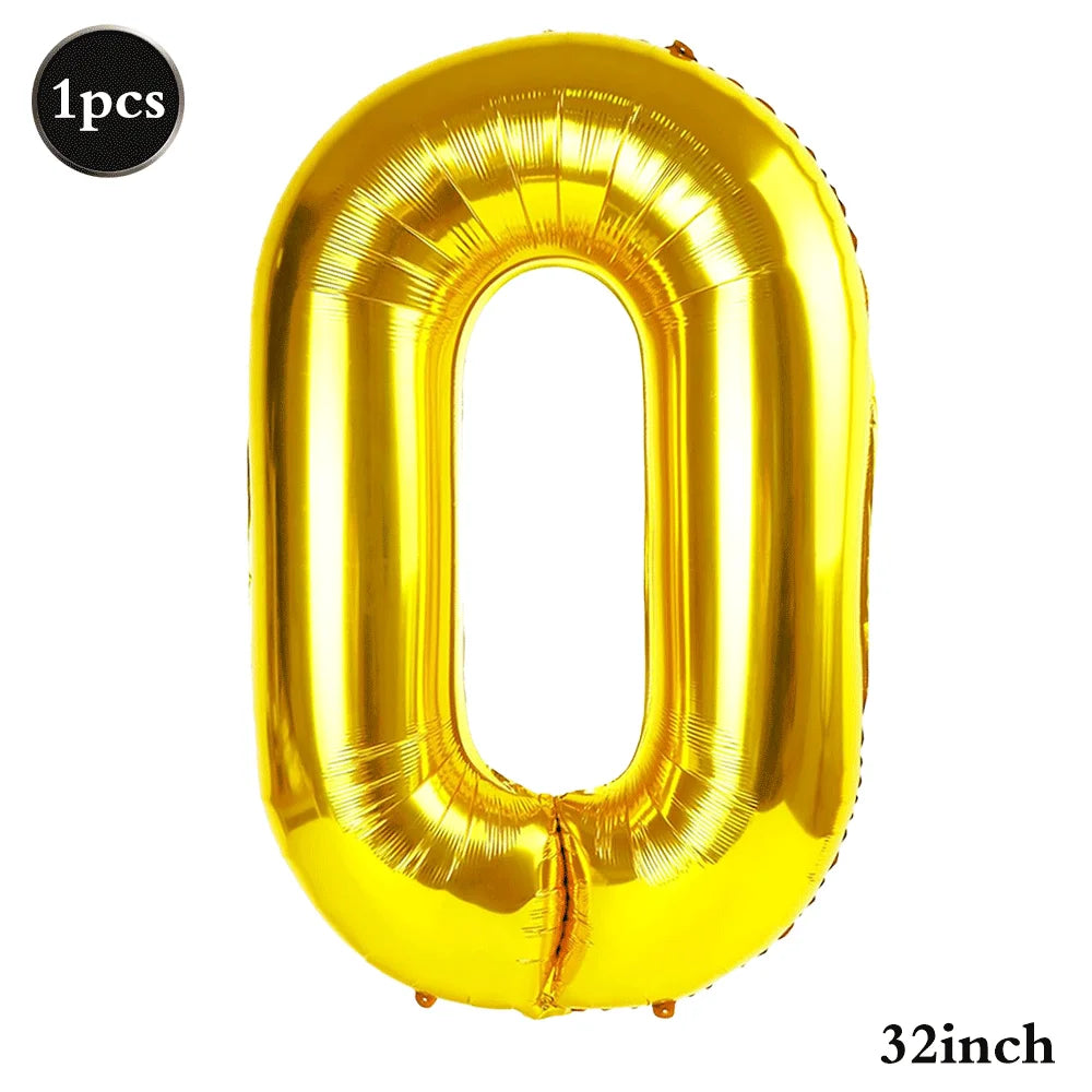 A shiny gold foil number balloon shaped like the digit zero, measuring 32 inches.