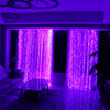 Purple fairy lights drape through a window, illuminating the room with vibrant light.