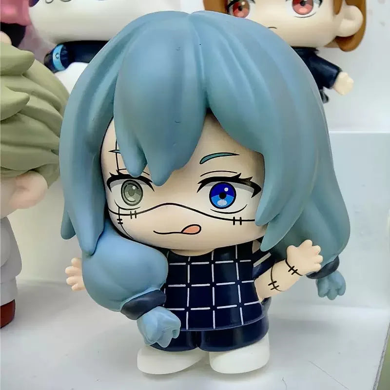 A blind box collectible figure of Gojo and Geto from Jujutsu Kaisen Season 2 featuring light blue hair and dark clothing.