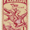 A vintage postage stamp featuring a woman riding a dinosaur over the word FLORIDA.