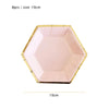 A pink disposable party plate with a gold rim, shown flat.