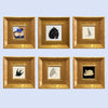 A set of six gold photo frames, each containing a vintage illustration of an animal or figure.