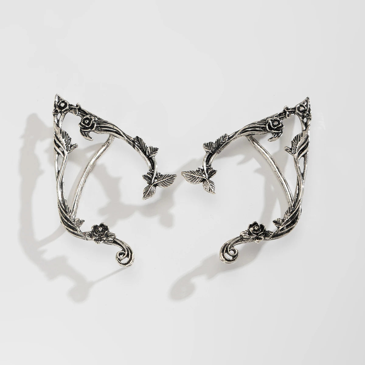 Silver elf flower leaf clip earrings for women with delicate foliage design