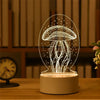 A clear acrylic night light shaped like a mushroom with glowing white lines on a wooden surface.