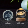 A comparison of a 3D crystal ball night light without a base and with a wooden base.