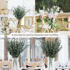 A collection of artificial eucalyptus leaves used for wedding and party decor arrangements.