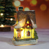 A festive Christmas house night light featuring a detailed miniature building with warm LED glow and snowy accents.