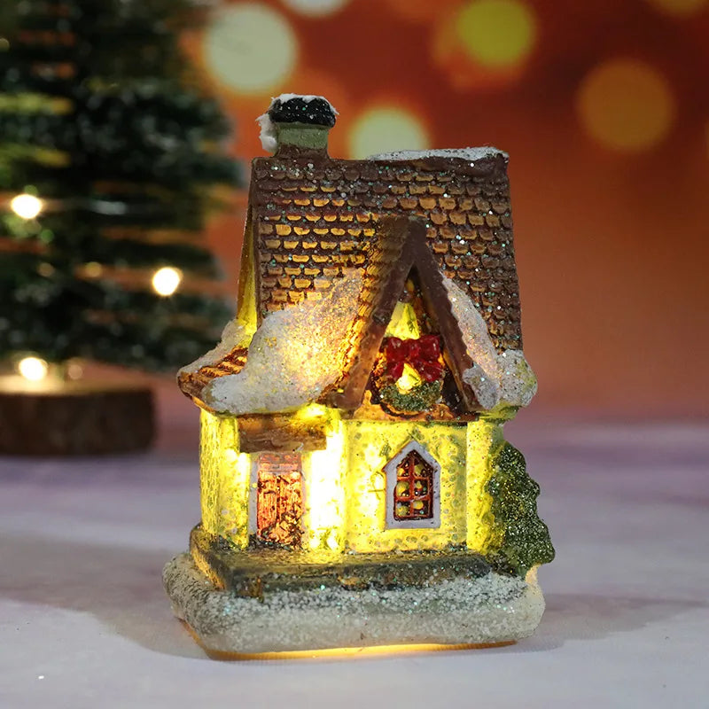 A festive Christmas house night light featuring a detailed miniature building with warm LED glow and snowy accents.