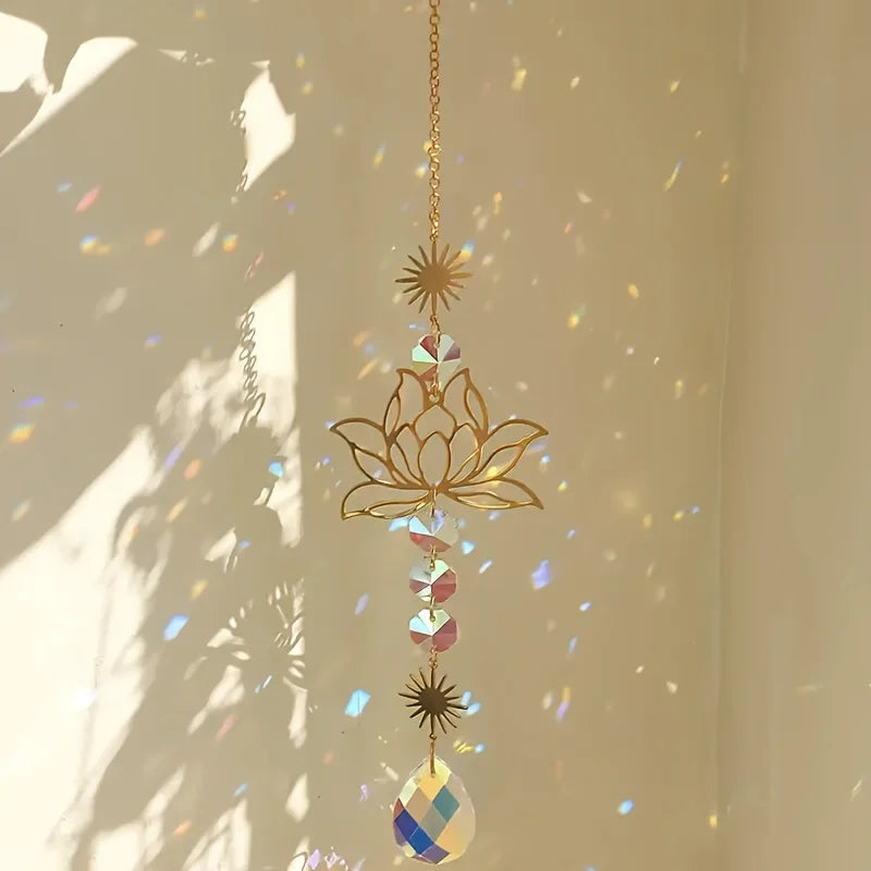 A hanging golden chain features a lotus flower crystal glass suncatcher with prism beads.