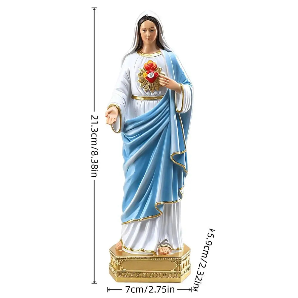 A white and blue statue of the Blessed Mother Mary with a golden halo and crown.