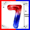 A large, red and blue foil balloon shaped like the number 7, decorated with spider webs.