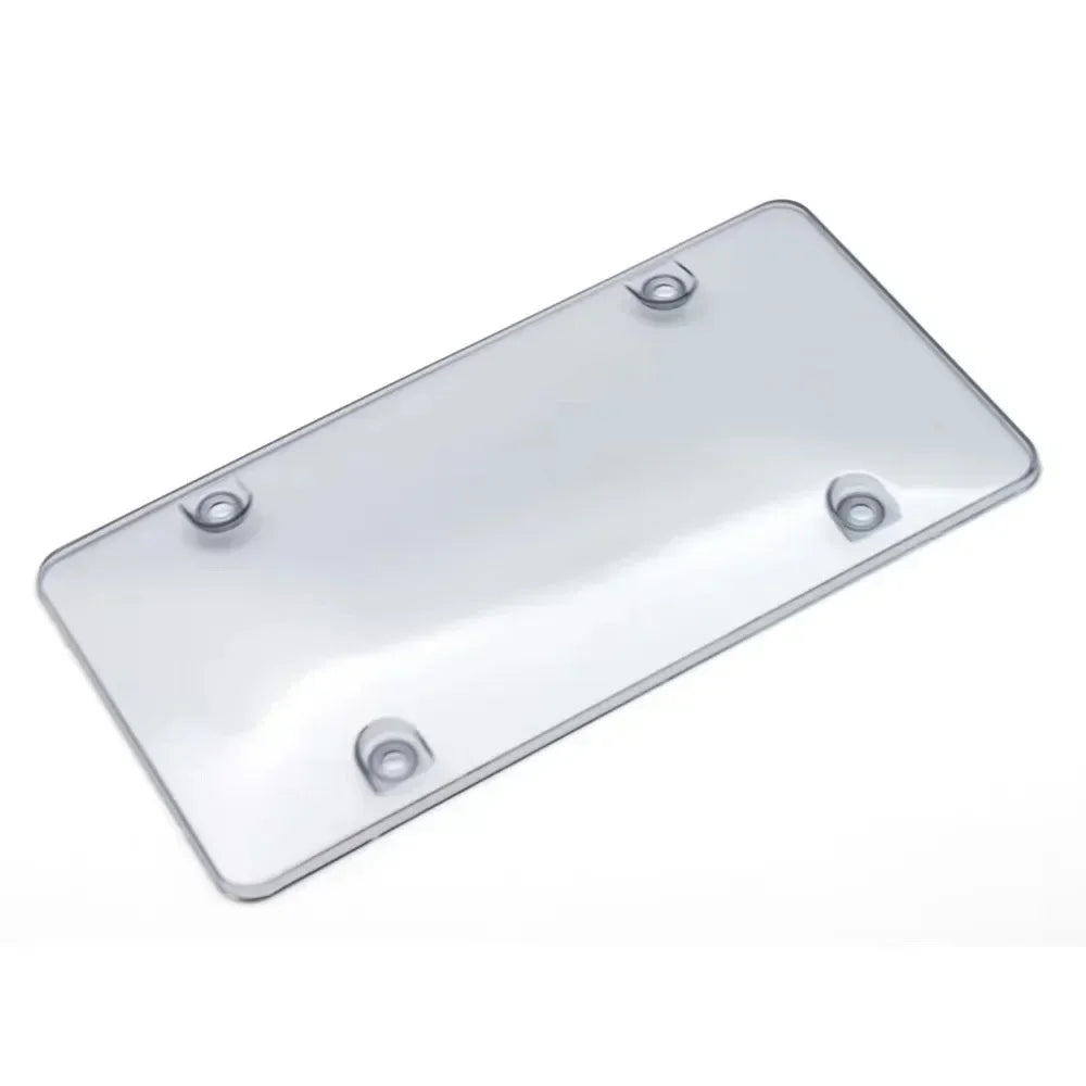 A rectangular, silver license plate frame with four mounting screws.