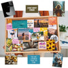 A wooden frame displaying various inspirational photos, quotes, and stickers for a vision board book.
