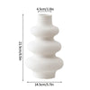 Modern white plastic decorative vase with stacked, rounded shapes.