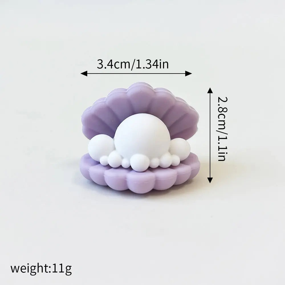 A set of three pastel purple ocean animal cake toppers, including a whale, octopus, and turtle.