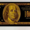 A close-up of a Federal Reserve Note, specifically a $100 bill from 1997, printed on black and gold paper.