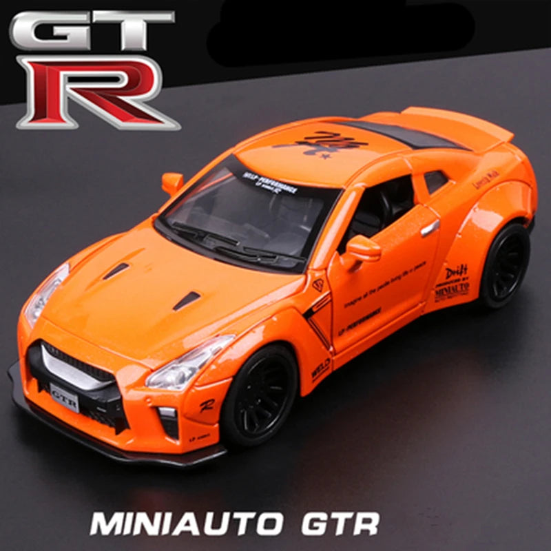 Orange MiniAuto GTR diecast sports car model in a studio setting.