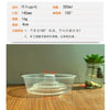 A clear plastic cup with a lid is shown next to a small glass jar containing plant material.