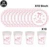 Pink checkered paper straws and cups with bow decorations for a birthday party