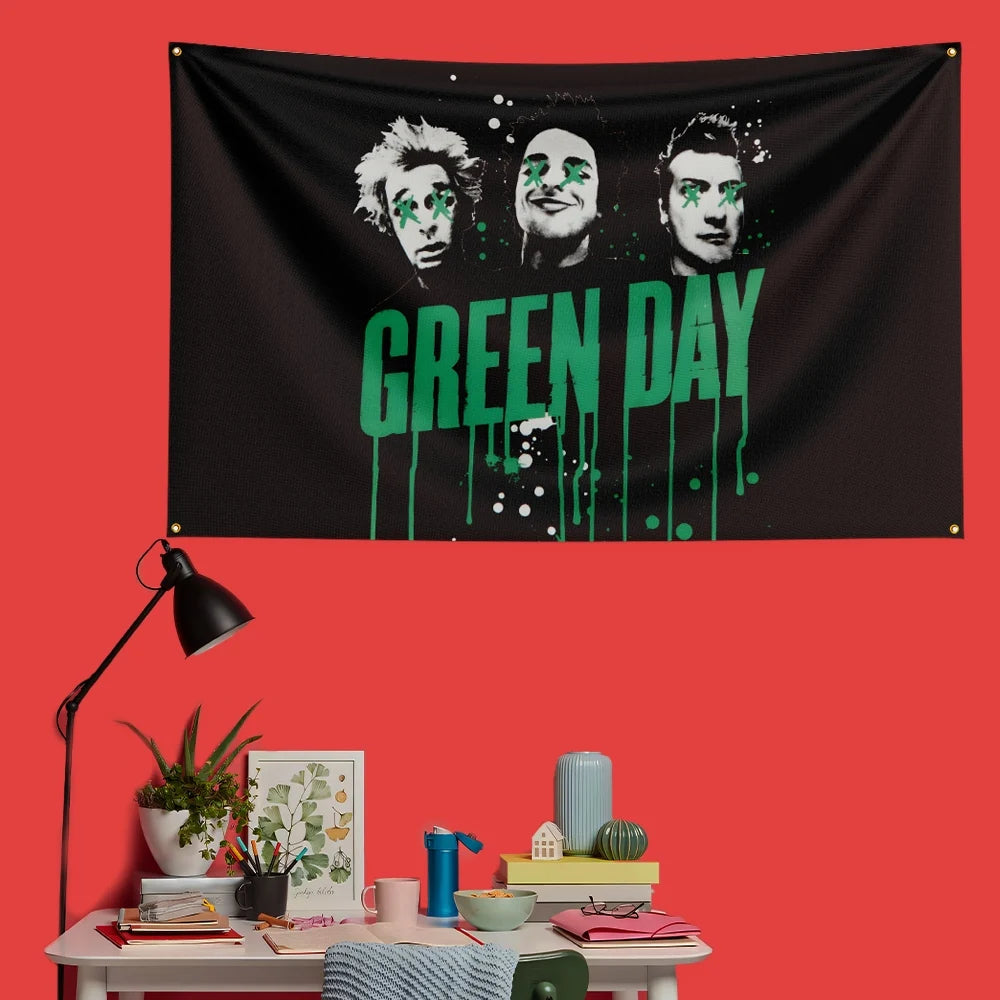 A black banner featuring the Green Day logo in green dripping paint and three band members' faces.