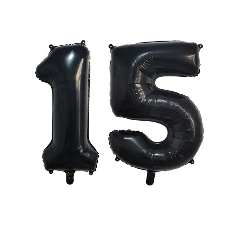 Black foil number balloons spelling out fifteen