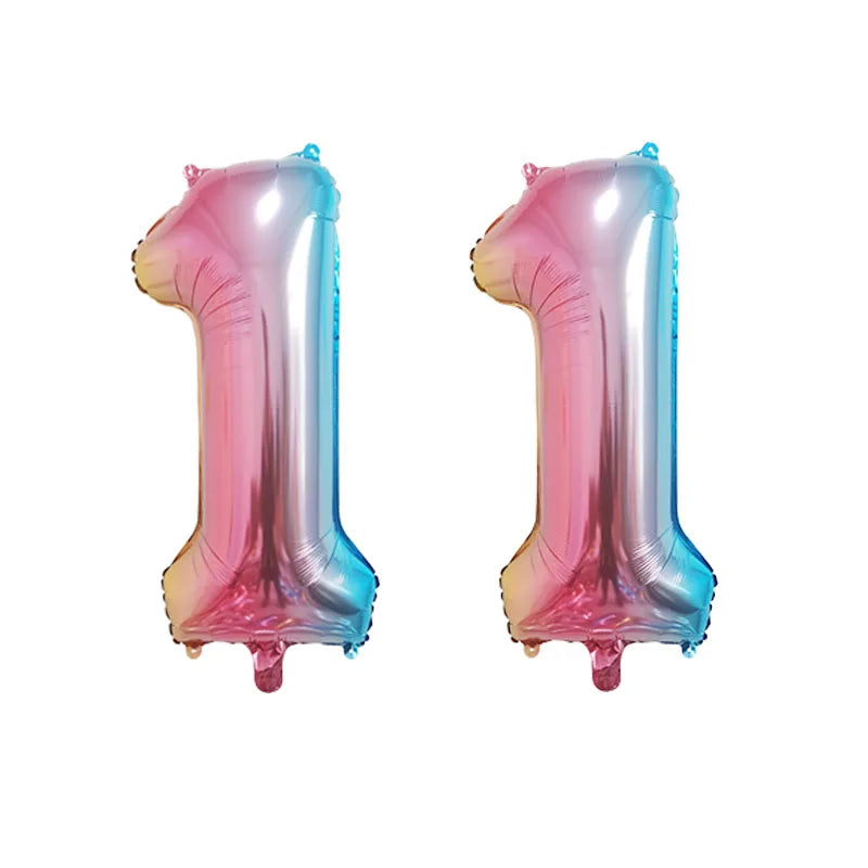 Two shiny pink and blue foil number balloons shaped like the number 1 for birthday party decor