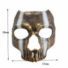 A full face resin mask of a Halloween skeleton ghost with striped metallic finish.