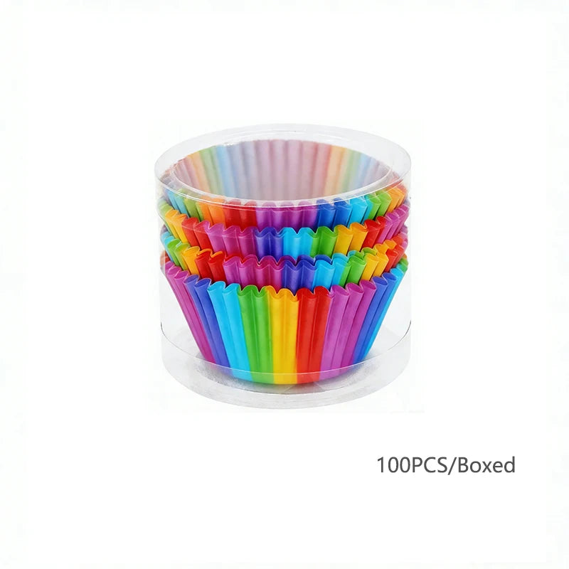 A box of 100 rainbow colored disposable cupcake liners stacked inside a clear plastic container.